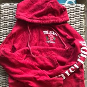Hollister red hoodie with rose detailing